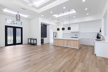 Foyer and kitchen of contemporary home by Stoughton & Duran